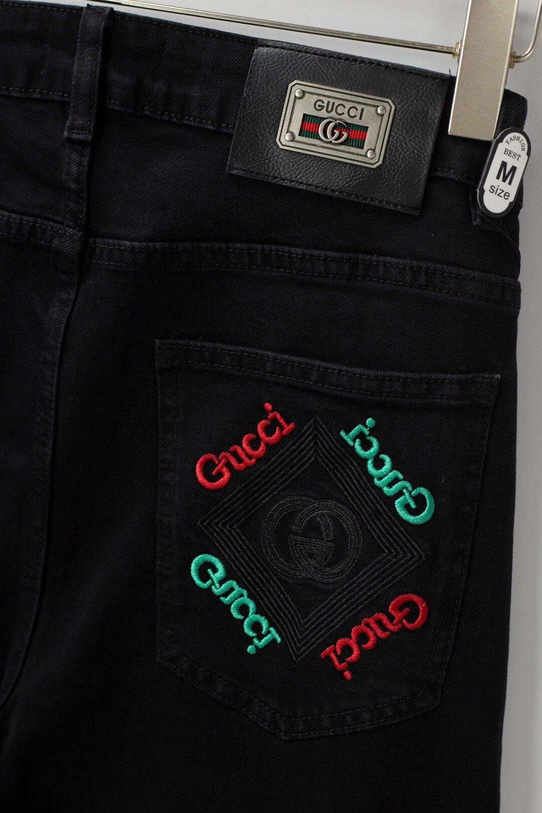 Red‑Green Letter‑Embroidered Jeans