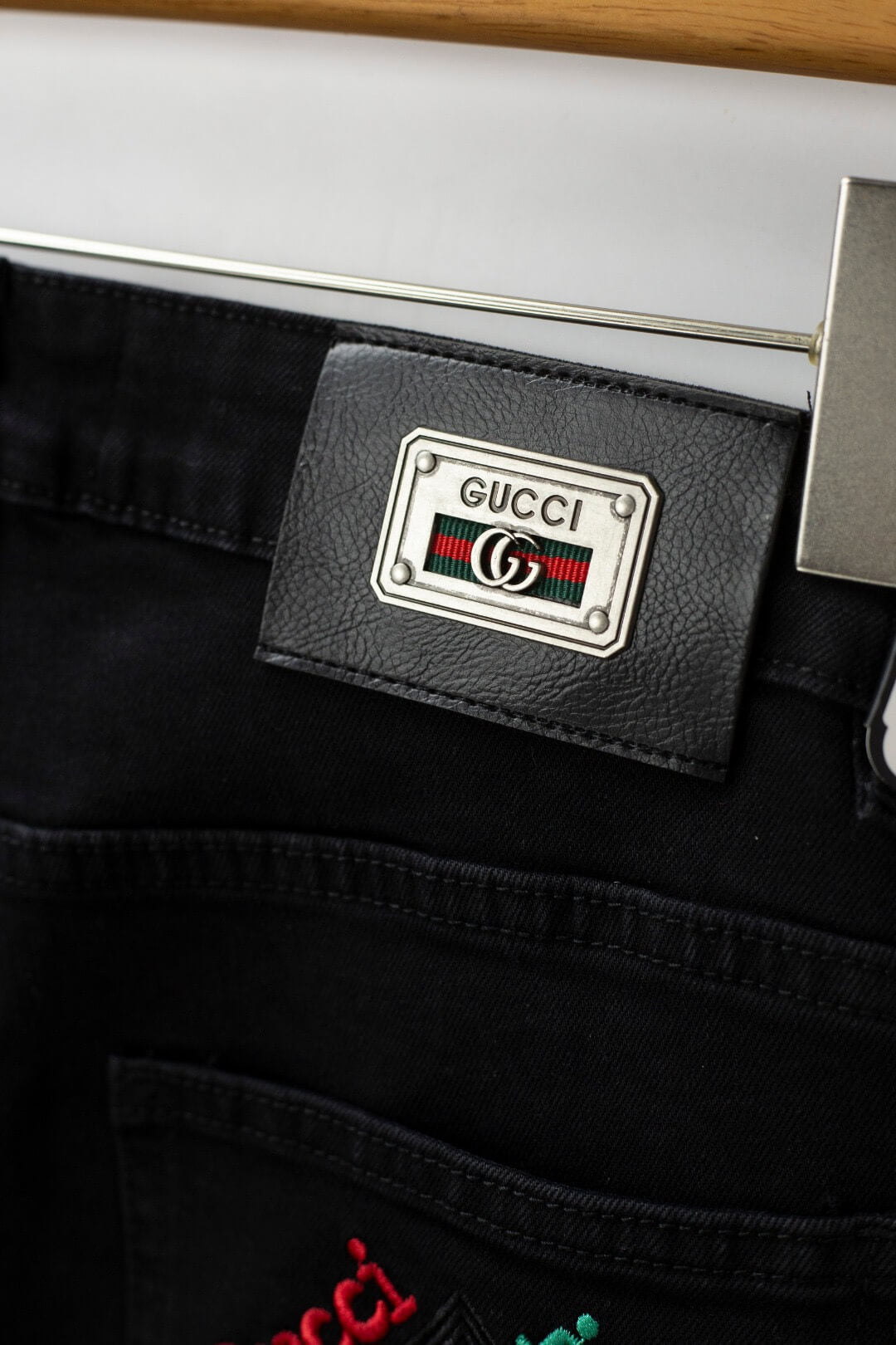 Red‑Green Letter‑Embroidered Jeans